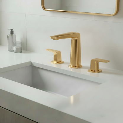 Bathroom with brushed gold faucet and mirror frame