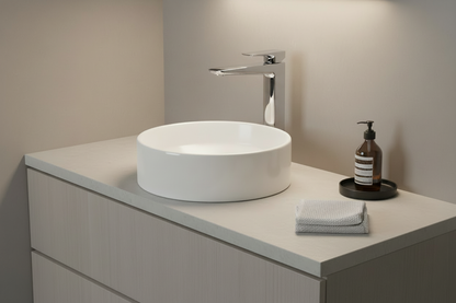 Modern bathroom with chrome squared vessel faucet