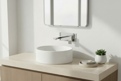 Modern bathroom with polished-chrome faucet and mirror frame