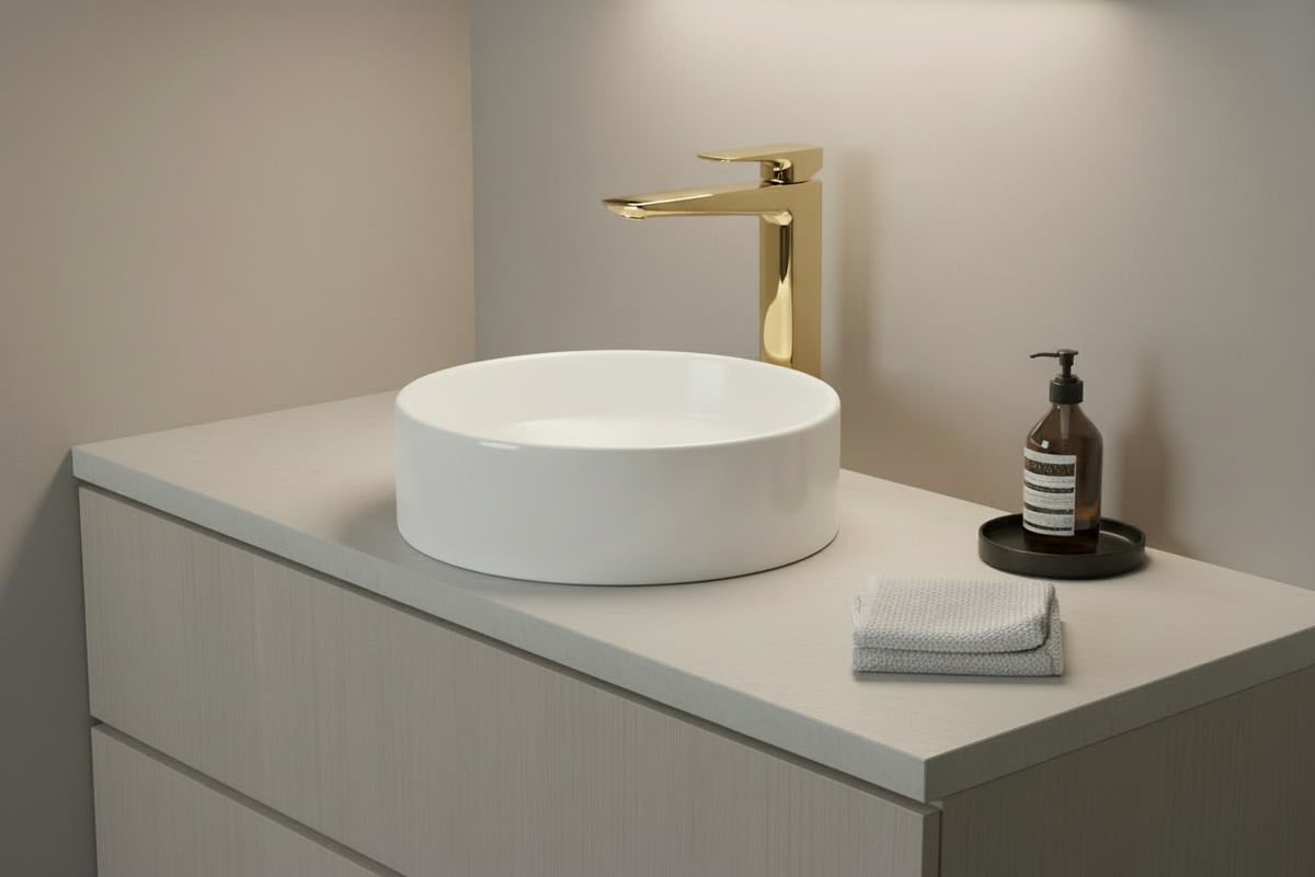 Modern bathroom with the squared faucet in brushed gold